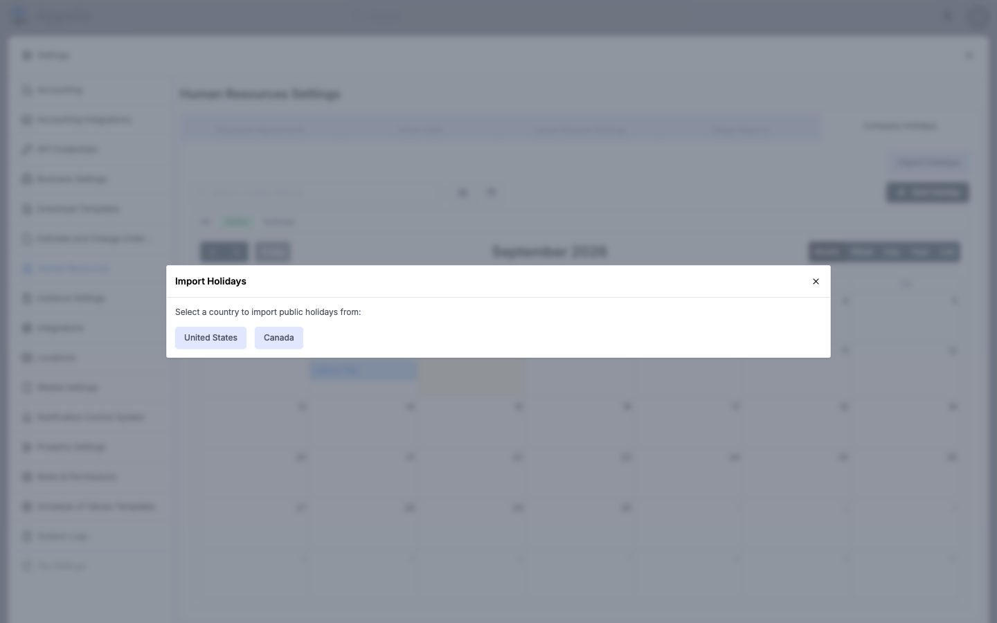 Import Holidays modal open, showing the United States and Canada country selection step