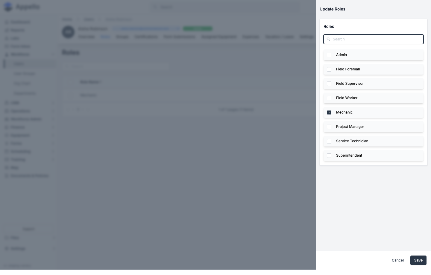Update Roles flyout listing every role as a checklist, with the user's current role checked