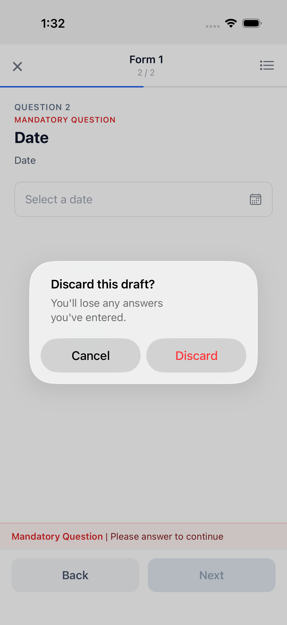 The native "Discard this draft?" confirmation alert, with Cancel and Discard buttons