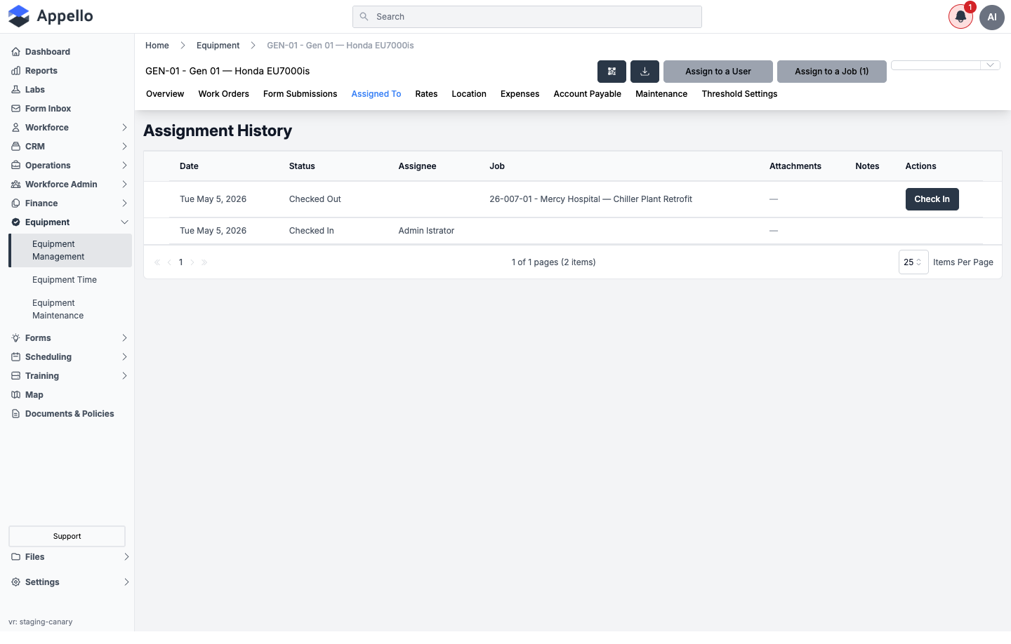 Assigned To tab, showing a populated Assignment History table with a checked-out and a checked-in row
